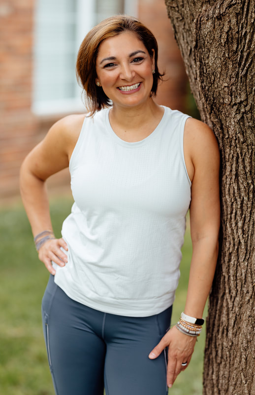 Neda Carnes licensed massage therapist, certified personal trainer, health wellness coach, TRX trainer, certified Buti yoga instructor, and owner of Trinity Wellness KC in Blue Springs, Missouri
